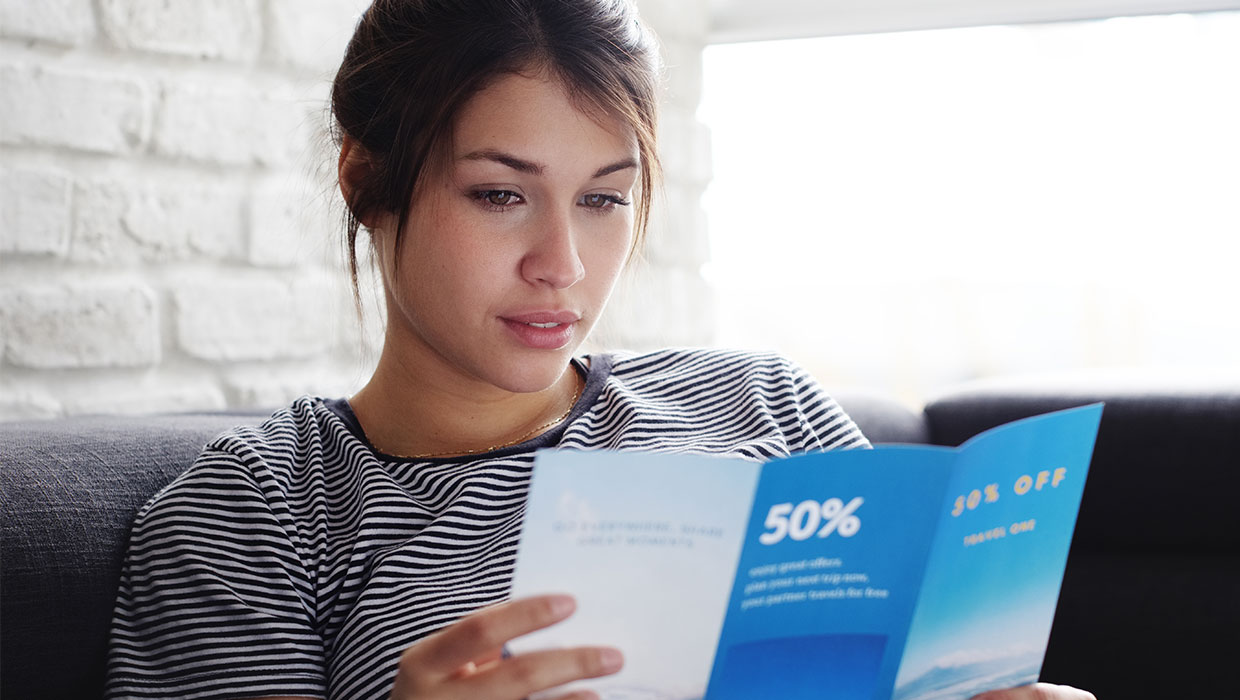 woman reading a brochure