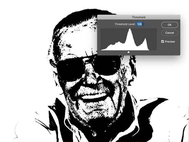 Grainy, black and white headshot of Stan Lee with Photoshop Threshold window