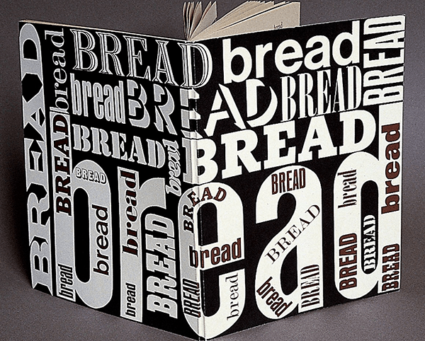 Hardback book covered in the word "bread" in bold black and white text 