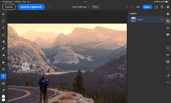 Screenshot of Photoshop with mountain landscape photo shows blue button at top of screen "Send to Lightroom."