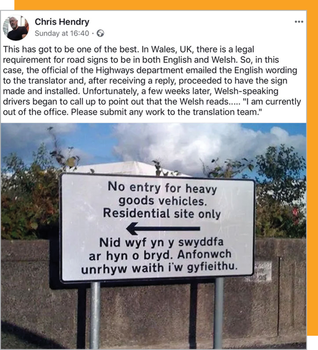 Road sign showing English and a Welsh text that is not a translation
