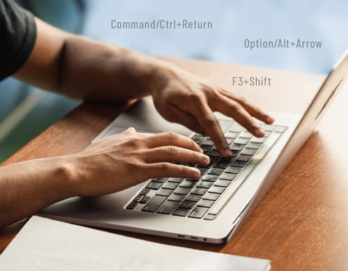 person using keyboard shortcuts for PowerPoint on a laptop