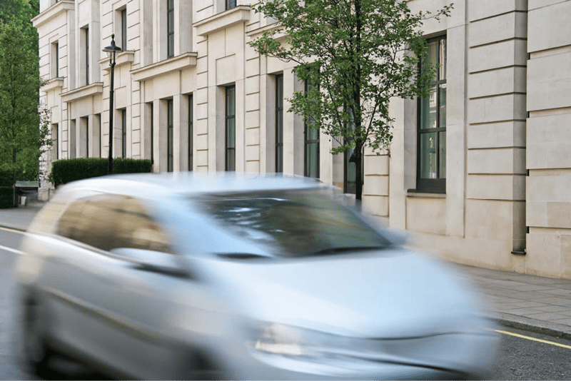 Figure 32. Love the speeding car, but who asked for a bush behind it?