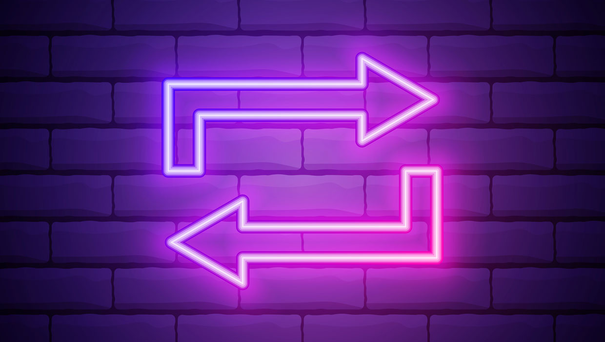 glowing purple reversed arrows on a brick background representing a history panel for accessing undo and redo history in InDesign